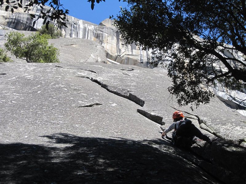 Start of the route on the 5.8 variation. The crux pitch is visible on the upper buttress.