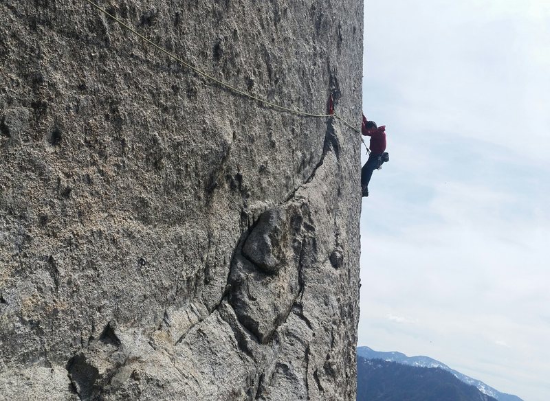 Brian on the crux traverse (pitch 5). Thin, delicate climbing.