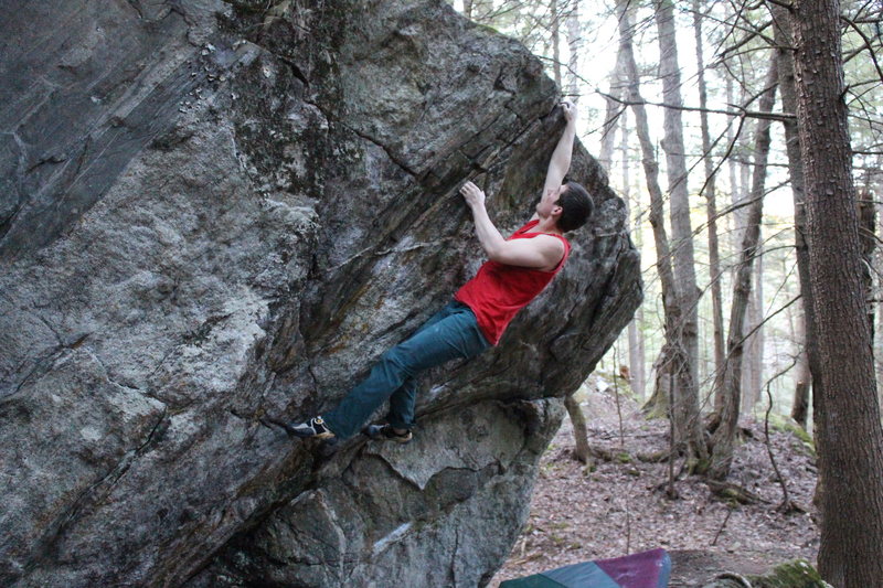 Grabbing the jug at the lip.