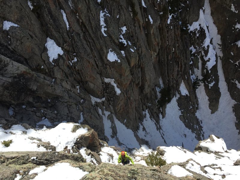 Belaying Ben up the first pitch out of the right couloir, M5, 120'.