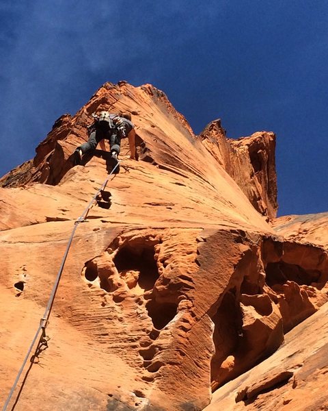 Steph leading the amazing twisting arete of pitch 4 on The Richness of it All.