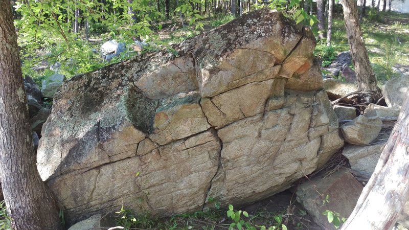 The clubhouse is behind the boulder and across the electric fence.