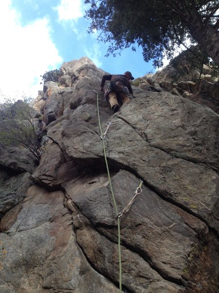 Above the first bolt.
