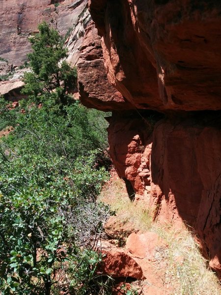 The approach traverses to the left under a small rock band.