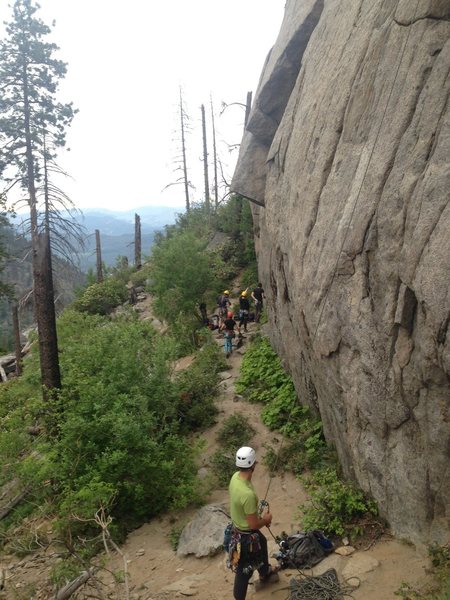 Climbers gathered around Celestial Groove and single climber belaying on Cloud nine.