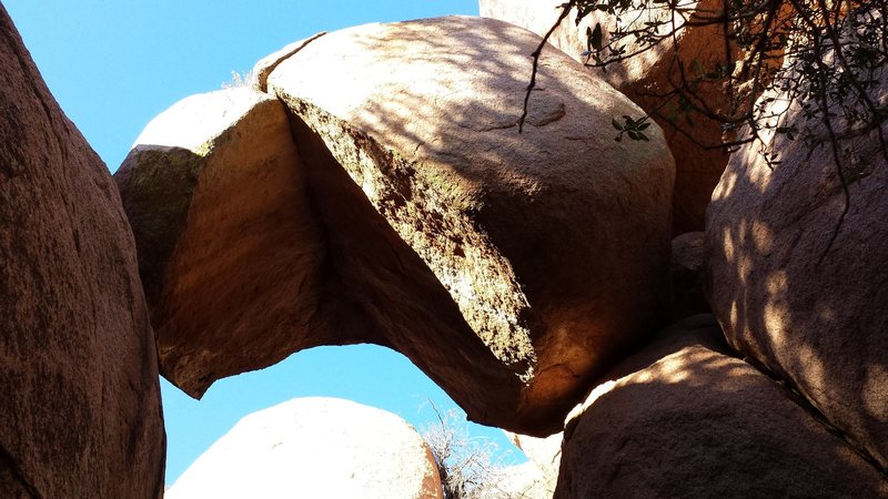 The "Pac Man" rock. You are close. There are a couple ways to get there, but you need to get to the other side of the big rock to your right.