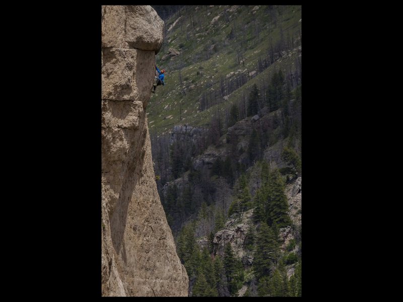 Kyle Vassolopolous reaching for the top. Photo by Kyle Duba.