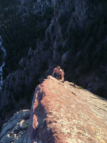 Michal solo on the finishing arete of Icarus, Tower One summit.