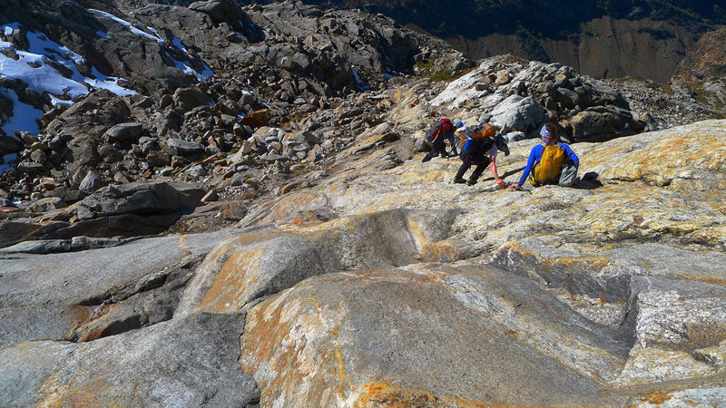 Descending the beautiful slabs below the glacier.