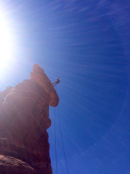 Starting the 80-foot free-hanging rappel down the north side of Kachina Woman.