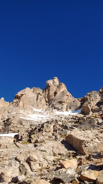 Molar Tooth. Climb a 5.7 stem pitch with 2 pitons that reaches the notch in the far left side of the photo, pass underneath a small chockstone at the notch with rap slings around it to access the southern traverse and tricky traverse