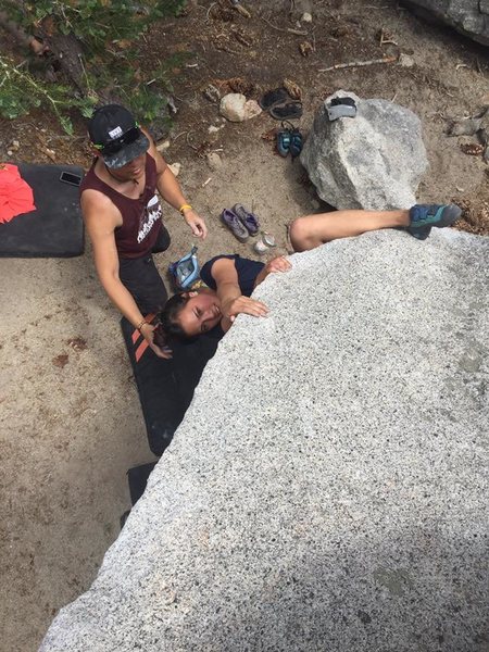 Pauline using the heel hook to set up the mantel move.
