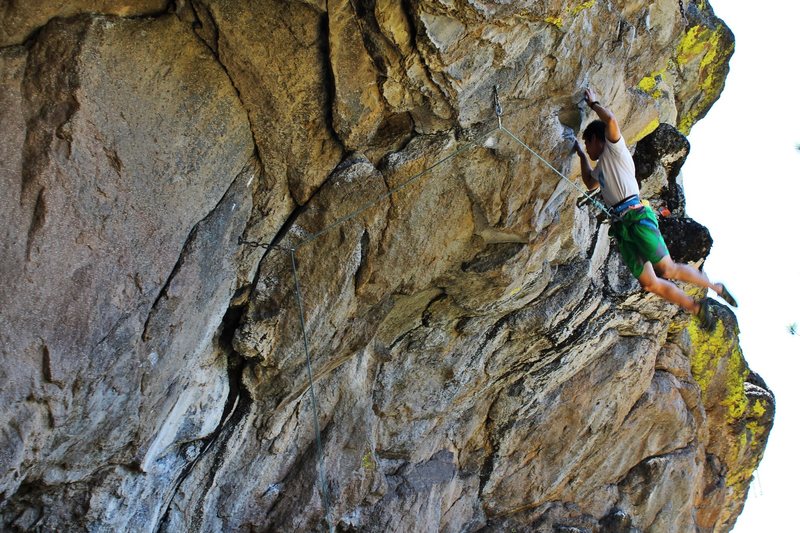Yusuke Komai on the crux move of before sending "Totally Chawsome".