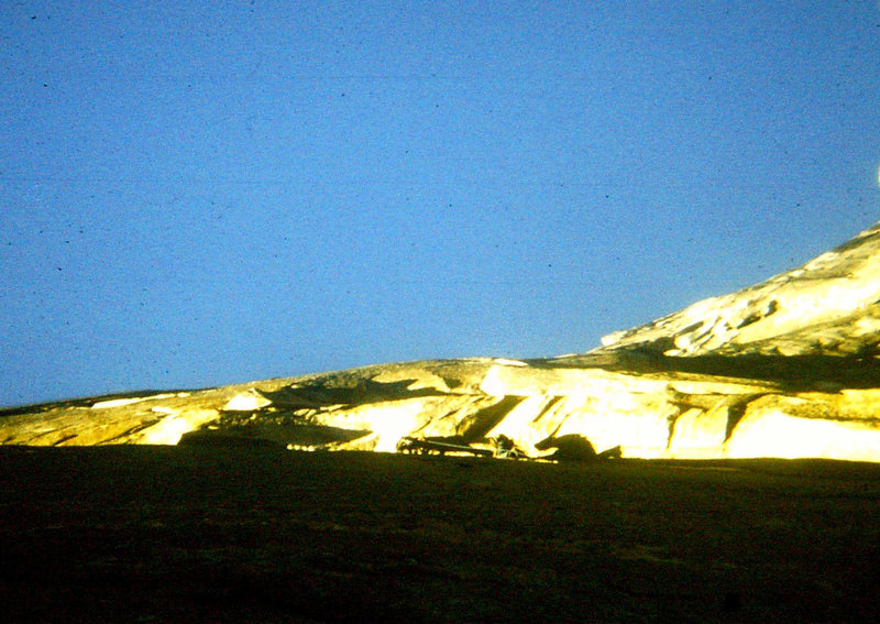 FA Mescalito 1973: Charlie Porter leading the Molar Traverse above. Hugh's shadow on the wall.