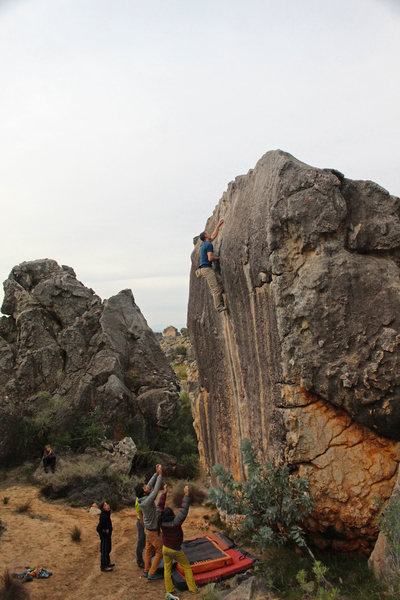 Making the easier transition onto the lower angle rock just short of the top, photo by Craig Faulhaber.