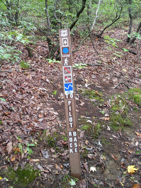 Trail-head to base of rock. This sign will be on the right as you hike up on the Pilot Rock trail. Pass through a few switchbacks and look for the sign. Hard to miss.