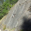 Connor demonstrating excellent footwork and a cool head while leading on Owl Slab.