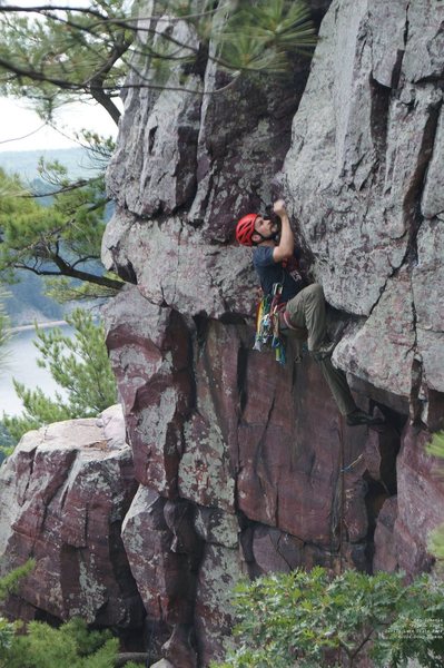Ben, in between the roof and the crux. You can actually sit on your left hip, here.