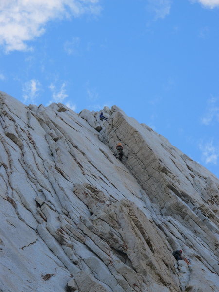 the only description I can come up with is "How to f@ck up someone's experience on a crux pitch". A dickish move IMHO, cosidering that after 4 pitch there are many ways to pass a slower party.