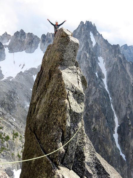 Janet on top of Aasgard Sentinel. Both Acid Baby and The Valkyrie share the same final pitch and both top out here. The 5.6 downclimb is on the right side of the tower where the rope is.