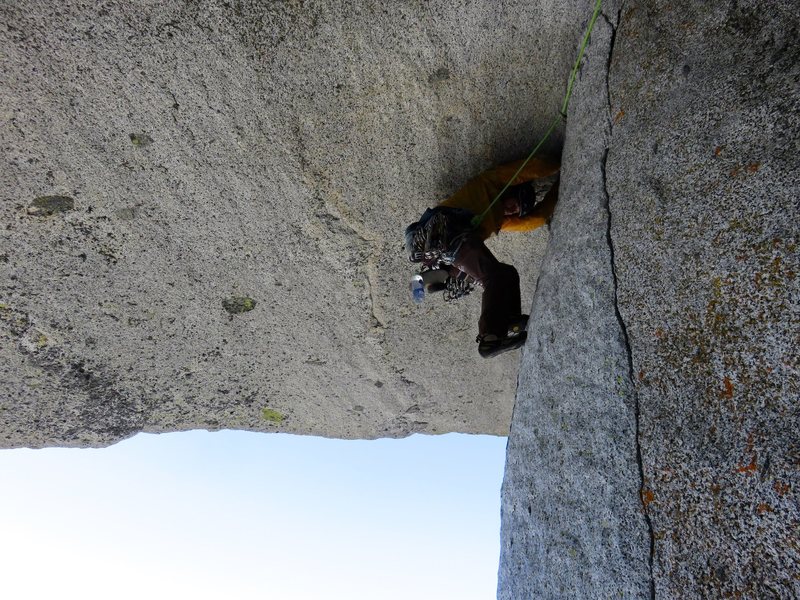 John on the wild traverse beneath the roof (Pitch 5). It is somewhat difficult because the feet are not so good and awkward if you are wearing a helmet (I took mine off when I followed it).