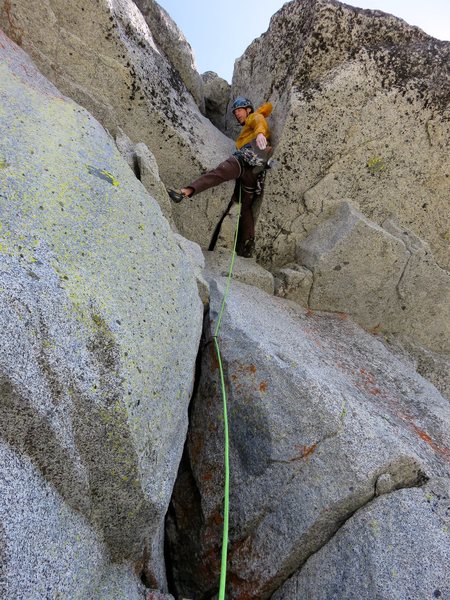 John entering the flaring chimney on Pitch 7. In his Cascades Rock guidebook, Blake called this the "region's hardest '5.8'".
