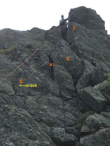 Route Photo 3: Top of P2 - The Chimney-Crack, key feature of the route. (In this photo the lower part of the v-chimney is obscured by lower ledges.)