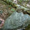 Rock with two small cairns indicating beginning of trail (out from the drainage) 