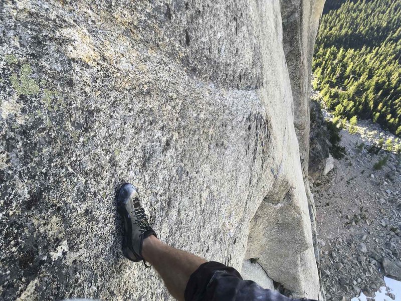 Looking down at pitch 8, the holdless 5.13- crimp fest.