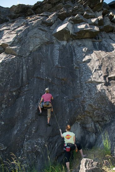 Working through the first move on 'Apron" (5.10a). The crack following the ceiling is the best feature of this climb.