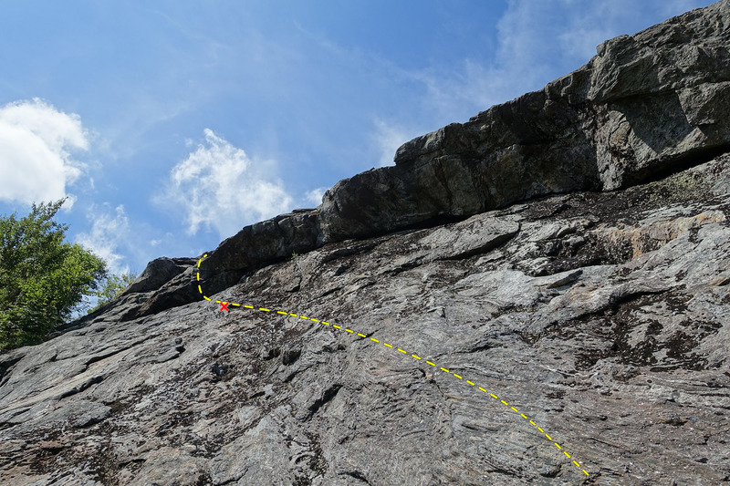 October Sundae Direct - Traverse left under the overhang, passing a bolt and surmount the overhang on the left end.