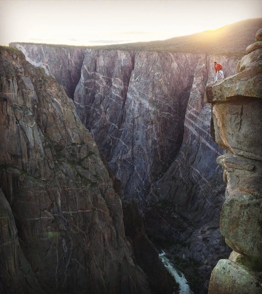 Looking over the abyss beyond the North Chasm View wall at sunset.