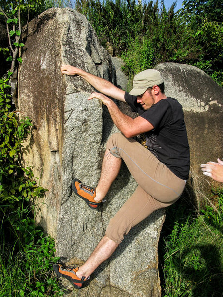 Swiss guy climbing Swiss Mix. Skin-tight pants and funky hat are optional, but encouraged.