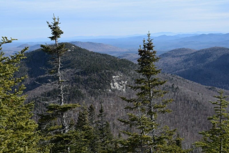 Looking East from the fire tower. The close, larger piece of rock is The Slab. Higher up are West Crag and South Crag. This shot shows the sharp delineation between the hardwood forest of the lower slopes and the upper conifers.