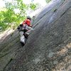 Starting up the right-most route on the Slab, "The Tao of Alces" (5.6 PG) on the first ascent.