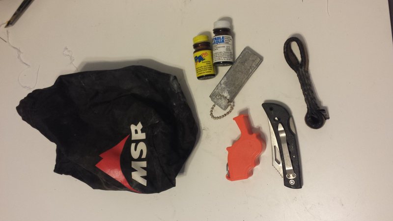 Bonus, iodine tablets, whistle, flint, knife MSR bag, and bd dog bone.