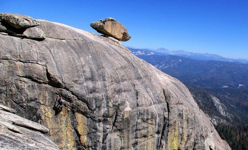 the green streaked wall of shangri la! anthony is topping out on the 5.9 warm up in the upper section and "doodle" the boulder stands guard on top