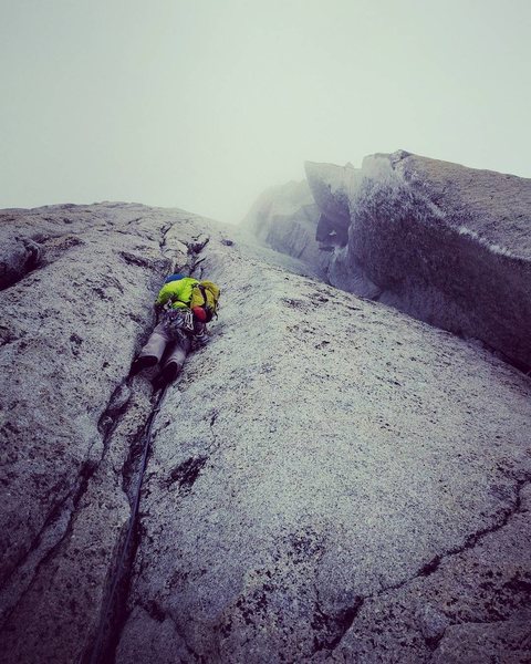 Nate during our Patagonian conditions ascent. The chimneys on P12 were completely iced over so we opted for the cracks out left.