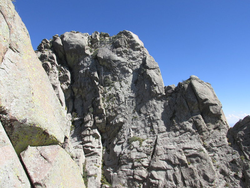 North face of the Wedge as seen from the West Ridge of Lost Peak. The two large steps are surmounted by pitches 3 and 4 of the West Ridge route.