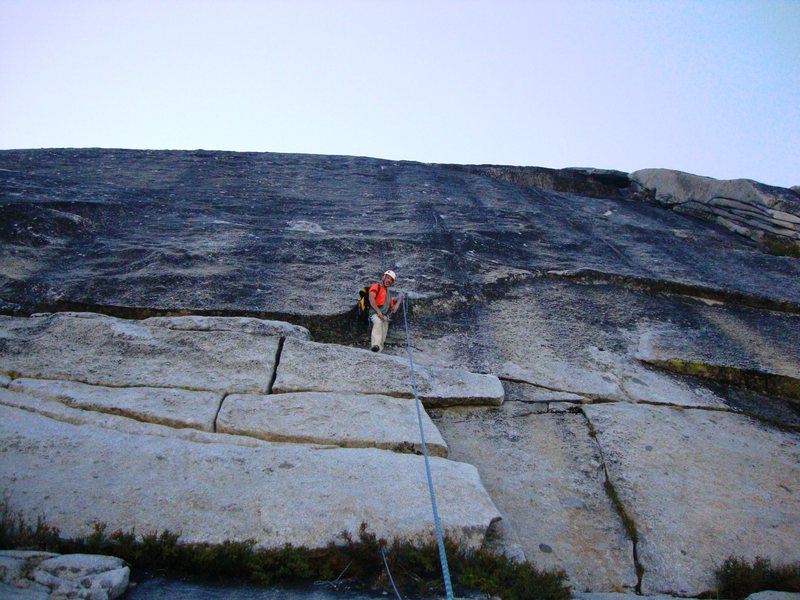 Warm Black Knobs: Herb Laeger at belay/rap station for 3rd pitch. Late in the day after completing FA with Gary Sullivan, swapping lead bolting often on this thin but rewarding pitch.