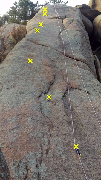Community Service from the base of the climb. Draws help show the bolts. 7 of 8 bolts are visible.