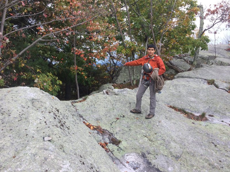 Alex points the way down the Hatch (note cairn)