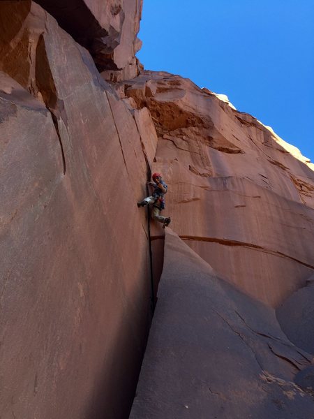 Parnas pulling the overhang to reach the second belay.
