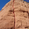 Dust Bowl Dance Topo.  The initial belay to bring up the second is just over the hump from where the leader emerges on the cap rock.  Here a trad anchor must be set.  The rap is to the north on the best rock to be found. 