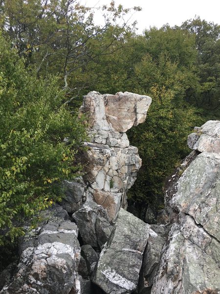 The classic view of the Wolf's Head Pillar from the top of Wolf Rock