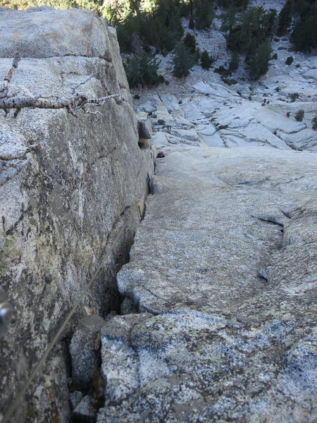 With a 70m rope you can link P2 and P3. From the ledge below (top of the P1 scramble) all the way to the sloping ledge with dead tree. If you look across right you can see The Long Climb. This pic is taken from there.