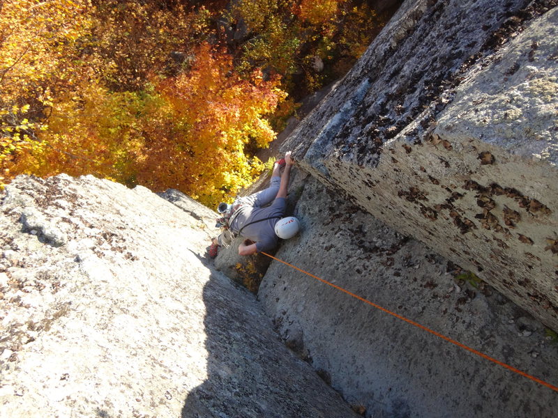 James Puckett on the crux mantle about halfway up "Stem It," 5.10d.