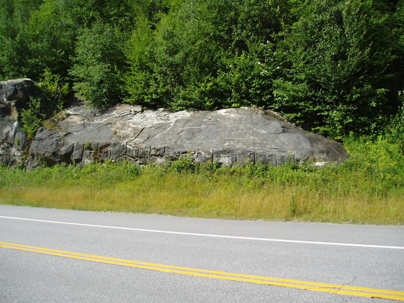 Climber's path to West End starts just right of this road blasted rock.
