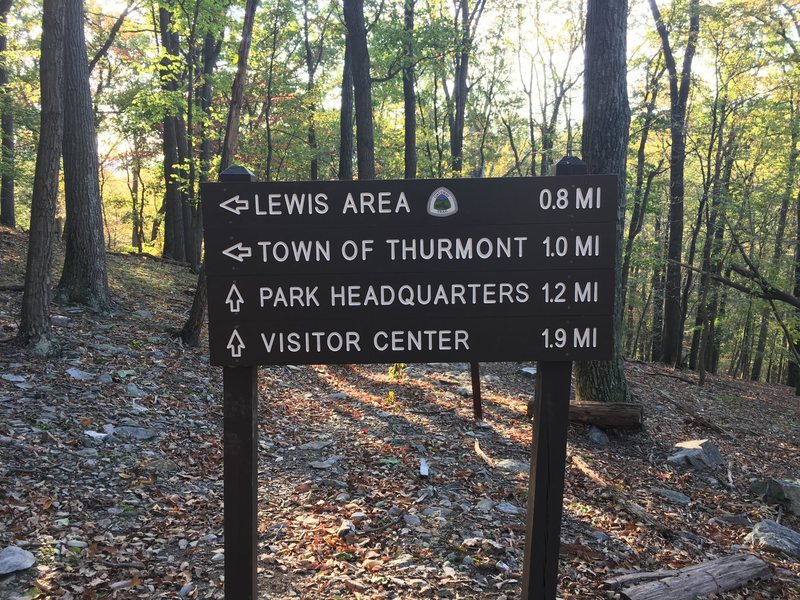 This sign marks the trail where the upper Gateway Trail Boulders begin. Traverse along the slope and the faces will become apparent. Hike down the trail a bit further for more problems down the hill.