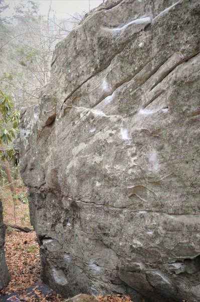 The starting inset jug with iron rails can be seen low in the corridor toward the end of the face.<br>
<br>
Follow chalked holds up and right diagonally to the nice chunky top out.